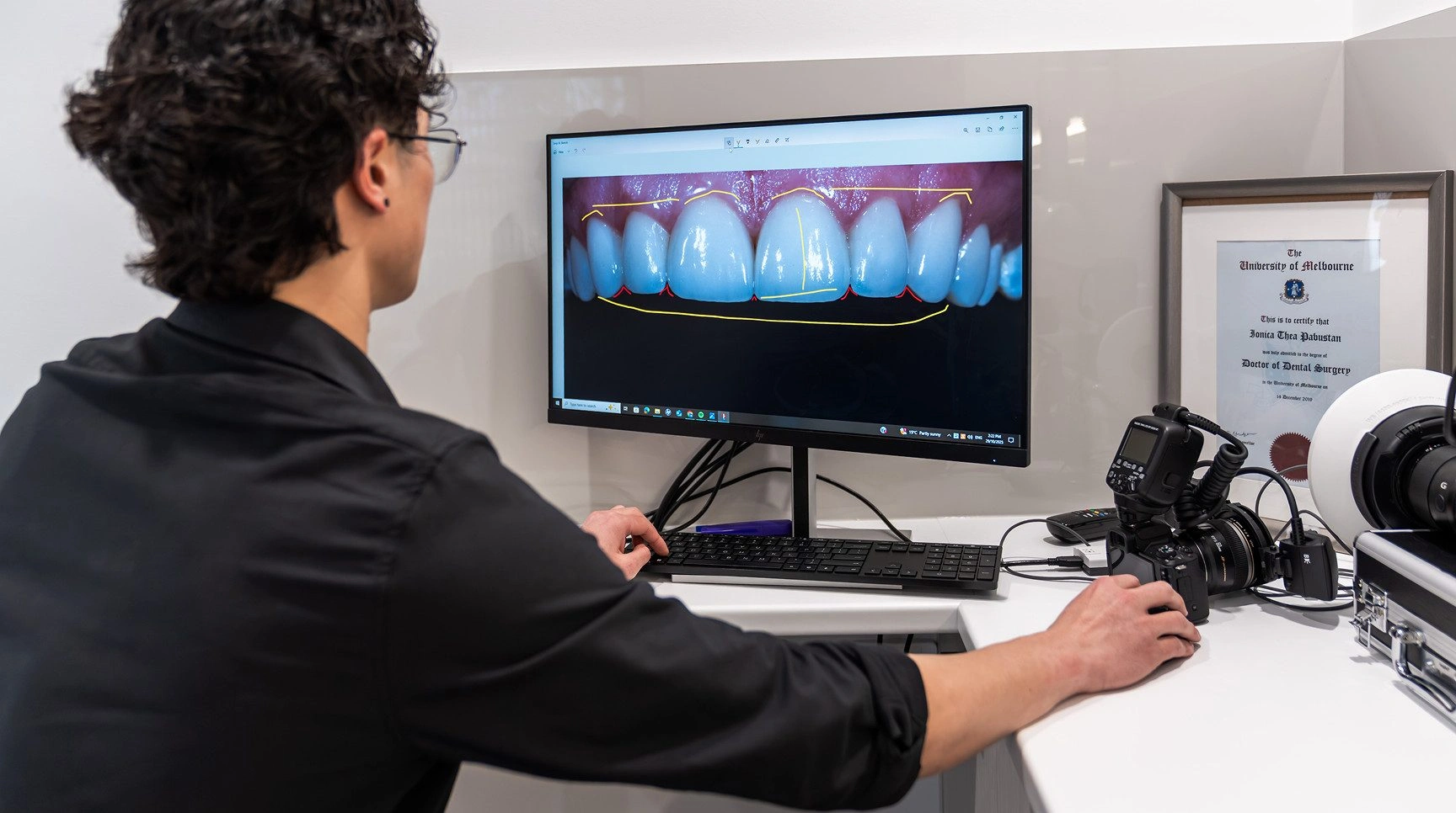 Dental team using digital software to design a patient's new smile at Dental Couture